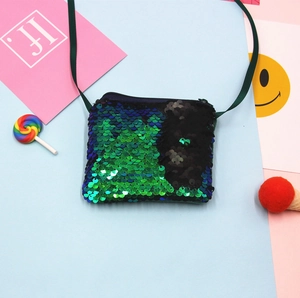 Detailed close-up of a green and black reversible mermaid sequin kids crossbody coin purse