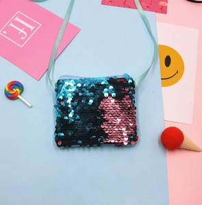 Close-up of mermaid sequin children's shoulder bag with colorful flat lay props.