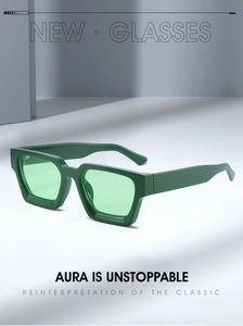 Detail of thick dark green square frame sunglasses with retro transparent green lenses