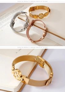 Detail showing mesh watch-band bracelet with clover charm in gold, silver, and rose gold