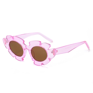 Pink translucent flower-shaped sunglasses with brown lenses and a stylish jelly finish