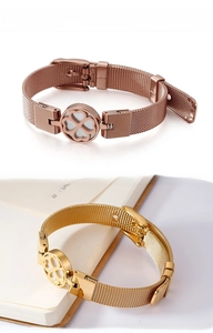 Detail of rose gold and gold clover mesh bracelets with adjustable watch band strap