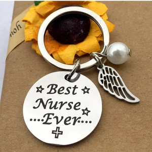 Porte-clés Best Nurse Ever en Acier Inoxydable Avec Aile d'Ange et Künstliche Perle Blanche Cadeau pour Infirmière Professionnelle
