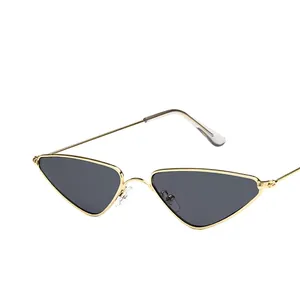 Vintage small triangle cat-eye sunglasses with gold metal frame and dark grey lenses