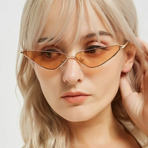 Retro triangle cat eye sunglasses with gold metal frames and orange transparent lenses