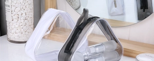 Detail of waterproof PVC travel bags with zippers and sturdy top handles for toiletries