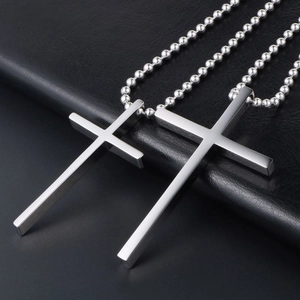 Minimalist titanium steel cross necklaces with bead chains in two sizes on black leather