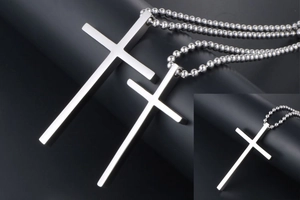 Detailed view of silver titanium steel cross pendants with beaded chain necklace