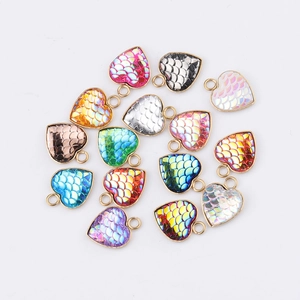 Golden heart-shaped fishscale pendants in vibrant gradient colors for DIY jewelry making