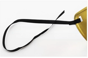 Detail of high-elastic black knit strap on gold painted masquerade mask for men