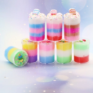 Detail view of 8-pack rainbow cloud butter slime jars with sprinkles and resin charms