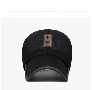 Close-up of the breathable mesh fabric and vintage leather patch on a black baseball cap