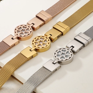 Mesh strap bracelet in rose gold, gold, and silver finishes with heart flower pendants