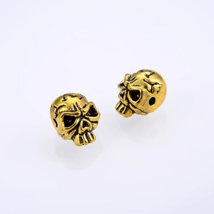 Vintage gold skull beads for DIY jewelry making featuring a punk style with horizontal holes