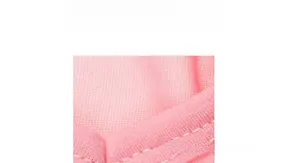 Detail view of pink knit pet vest fabric featuring high-quality white overlock stitching