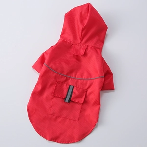 Detail of red pet raincoat featuring honeycomb waterproof fabric and reflective safety strips