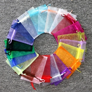 Multicolor organza gift bags with satin drawstrings in a vibrant circular layout