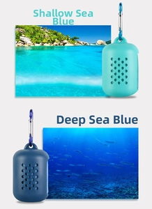 Detail of portable silicone cases in Sea Blue and Deep Blue with metal carabiners