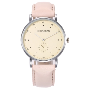 Detail of pink leather strap and silver case with yellow dial quartz watch