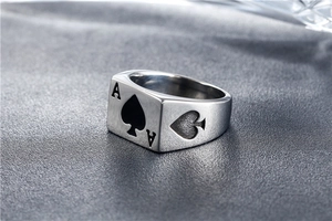 Macro shot of punk style spade A signet ring with engraved stainless steel details