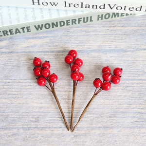 Three stems of realistic red artificial berries for Christmas and wedding decor