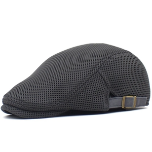 Close-up of breathable mesh fabric and adjustable bronze buckle on dark gray cap