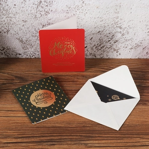 Elegant Christmas card set with gold foil lettering on red and green paper with envelope