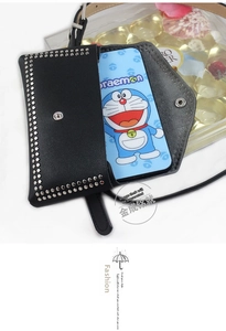 Detail view of a black leather waist bag with silver studs and flip cover for smartphones