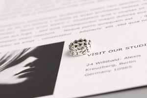 Detail of S925 silver adjustable ring featuring a double row of heart patterns
