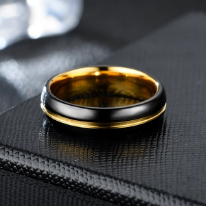 Minimalist brushed black and gold stainless steel ring for couples featuring ceramic finish