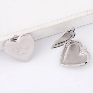 316L stainless steel heart locket pendant with I Love You engraving on white background