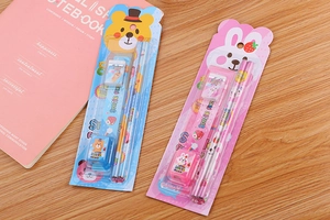 Detail of children's stationery set with cartoon pencils, ruler, eraser and sharpener