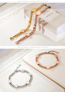 Dettaglio dei bracciali a catena con ciondolo a cuore in oro, oro rosa e argento lucido