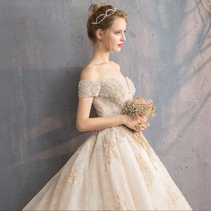 Luxurious off-shoulder starry bridal gown with intricate beadwork and floral embroidery