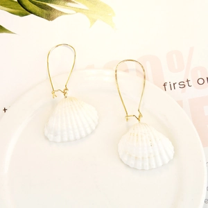 Bohemian style ocean shell earrings with natural white texture and golden hooks