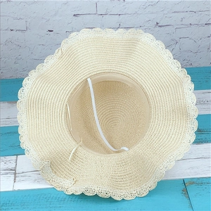 Women's summer straw hat with lace hollow brim and elastic wind rope in beige