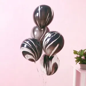 Detailed view of 10-inch thick agate latex balloons with black and white marble patterns