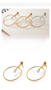 Detail view of 36mm stainless steel hoop earrings with shell pearl charms in three colors