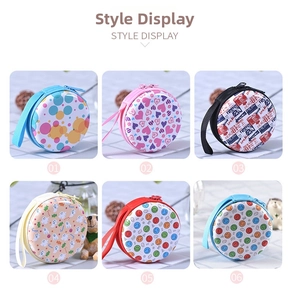 Variety of colorful round tinplate coin purses with zipper and carrying straps