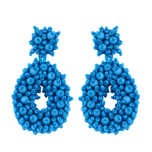 Bohemian blue seed bead drop earrings with hollow oval design and handmade woven texture