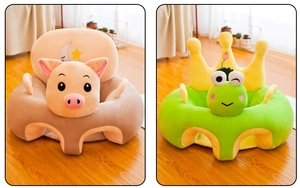 Detail showing plush baby support seats in cute pig and frog shapes on wooden floor