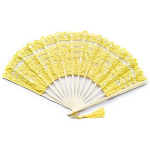 Detailed view of yellow lace folding fan with intricate embroidery and elegant tassel