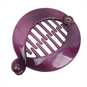 Detail of a dark purple transparent resin banana hair clip with internal dual-row comb teeth