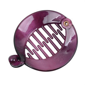 Detail view of purple banana hair clip with dense teeth and NO:B186 engraving
