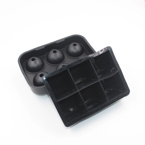 Detail view of black food-grade silicone molds for 6 square and 6 spherical ice cubes