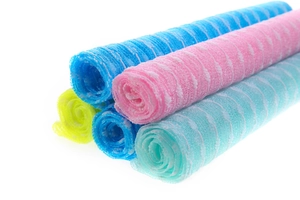 Detail view of multi-color nylon exfoliating back scrubbers in a stack