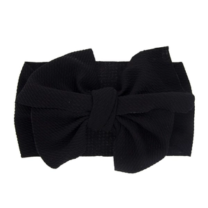 Black waffle texture baby headband with a large bow, stretchy newborn hair accessory