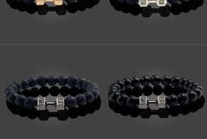 Detail of beaded dumbbell bracelets with engraved Live and Lift metal charms