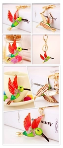 Detailed close-up of hummingbird keychain with red green gradient and rhinestones