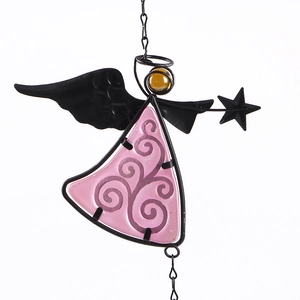 Detailed close-up of an angel wind chime featuring pink glass wings and spiral metal patterns